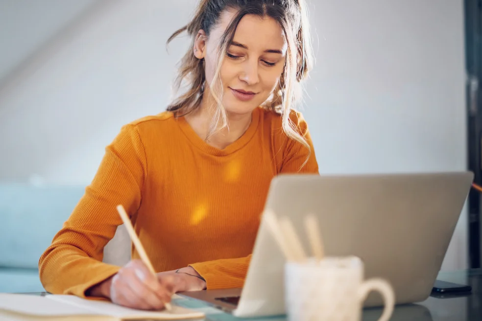Woman working from a home on her a laptop