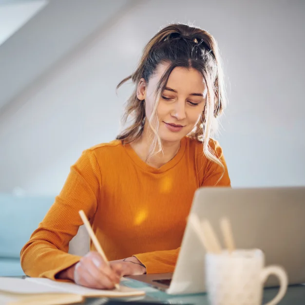 Woman working from a home on her a laptop