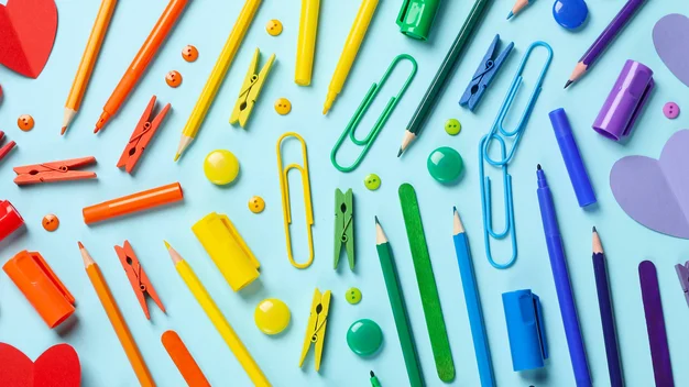 The picture shows various paper clips and hearts that form a rainbow.