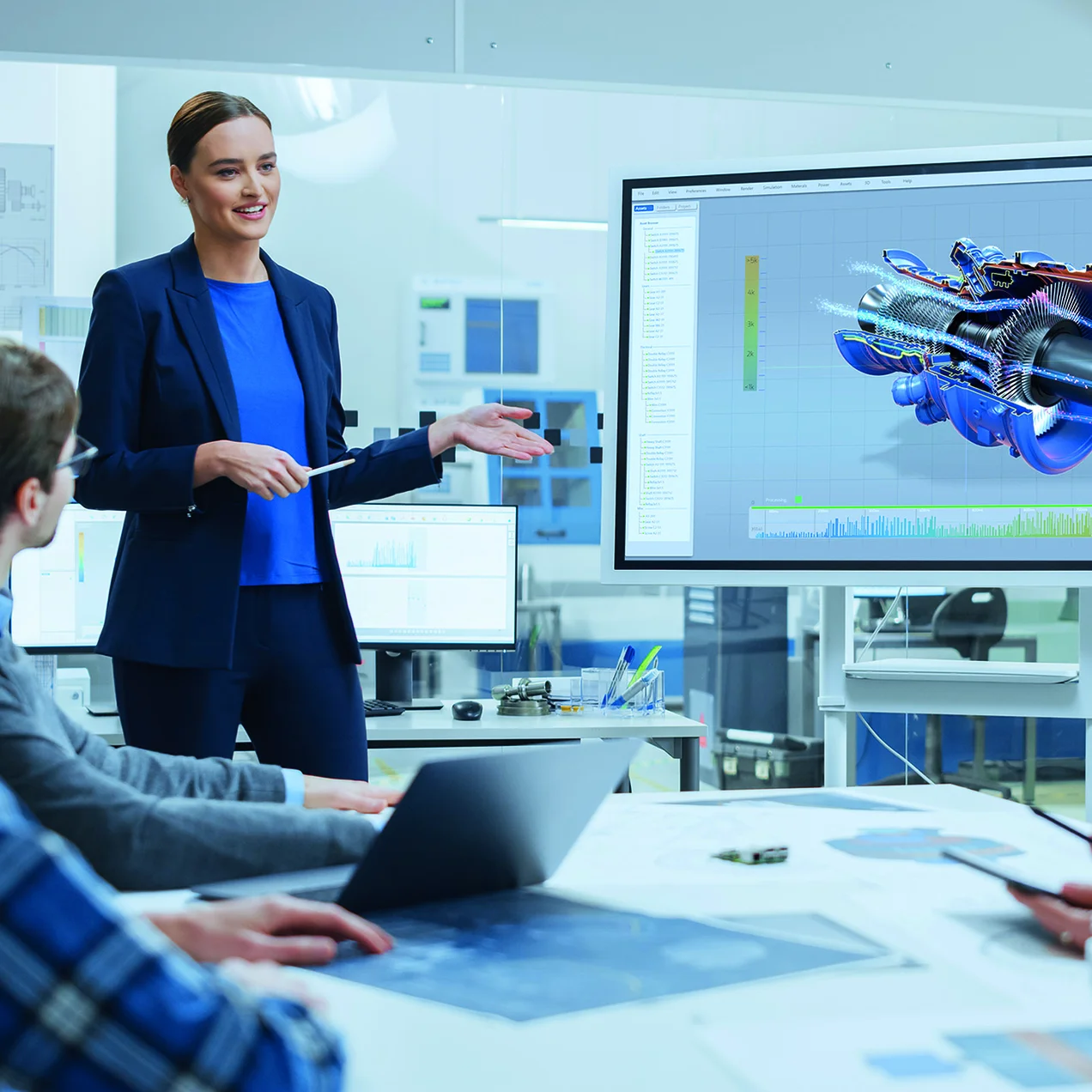 1282301044 Confident Female Automotive Engineer Reports to Diverse Team of Specialists, Businesspeople and Investors Sitting at the Conference Table, She Use Interactive TV, Analyze Sustainable Energy Engine